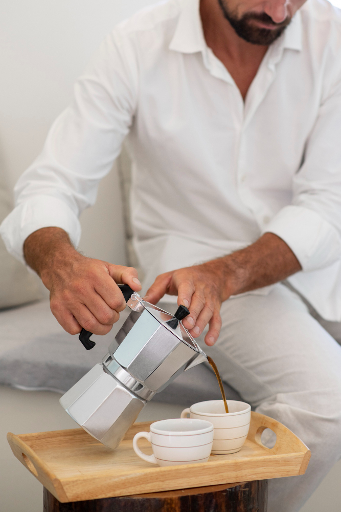 Man pouring coffee with moka express